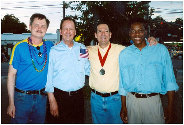 JD Doyle, John Lawrence, Mitchell Katine, and Tyron Garner at the 2004 Pride Parade in Houston.